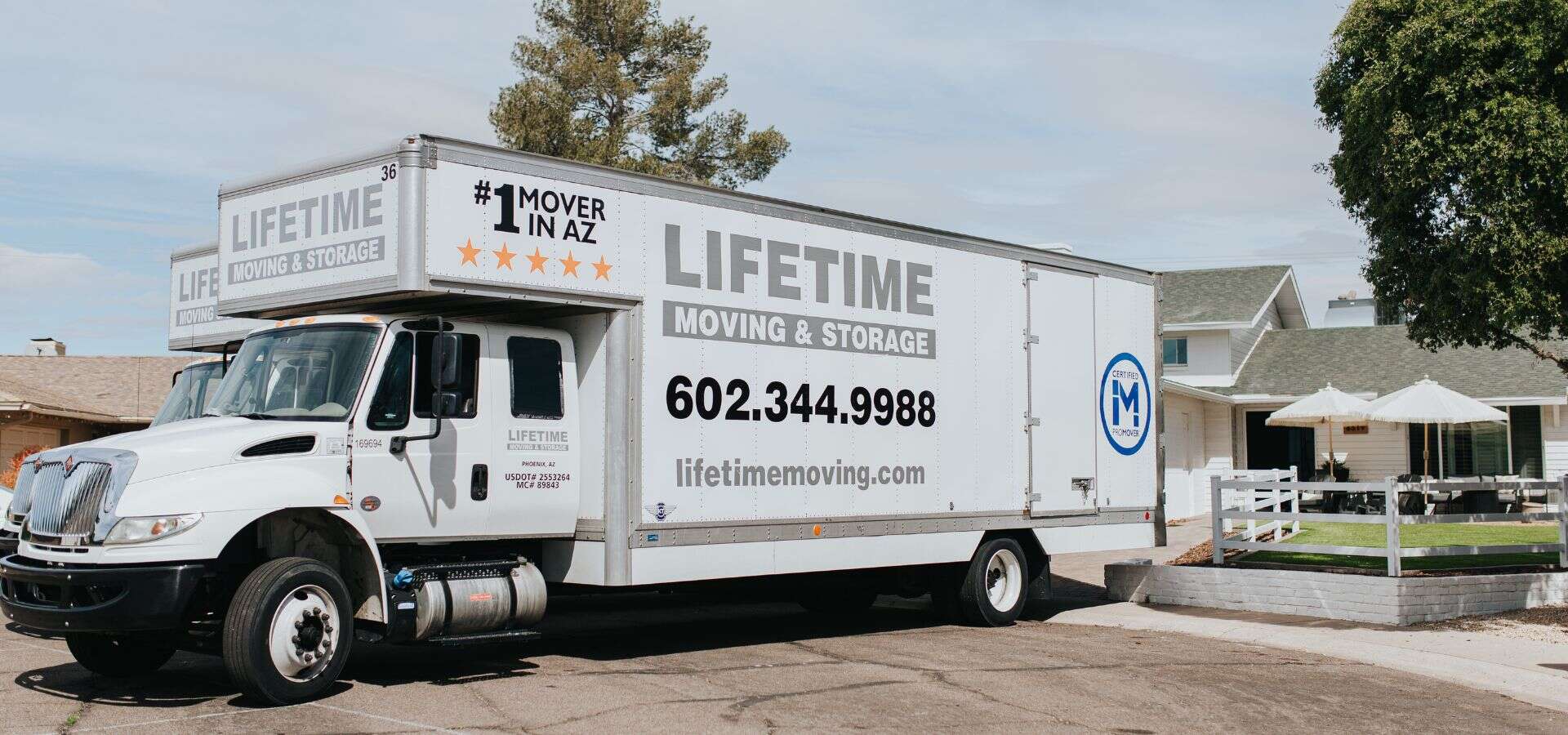 Lifetime Moving & Storage branded truck parked at a Phoenix residential property