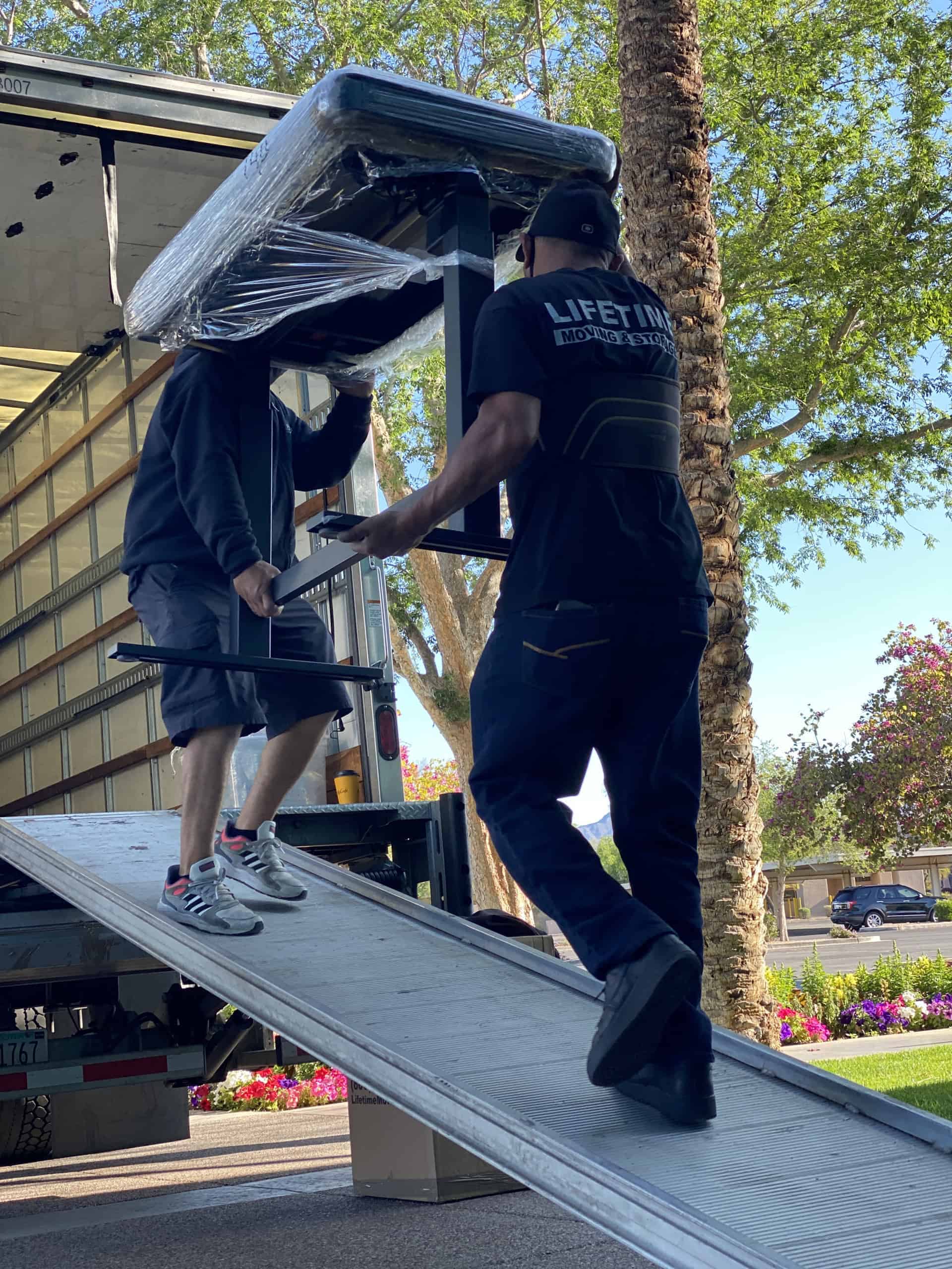 Lifetime Moving & Storage crew loading boxes into a moving truck