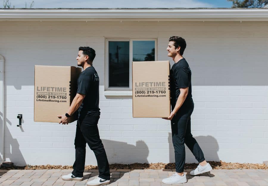 Lifetime Moving & Storage local mover carrying boxes at a Phoenix property