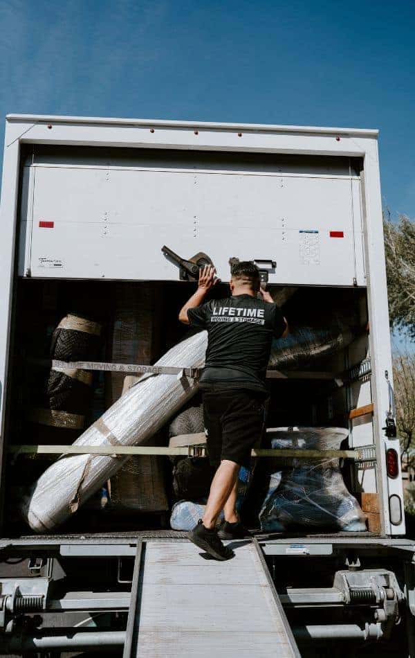 Lifetime Moving & Storage professional loading boxes into a moving truck