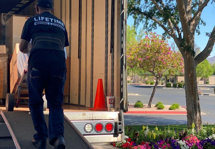 Lifetime Moving & Storage senior movers carefully assisting with a residential relocation