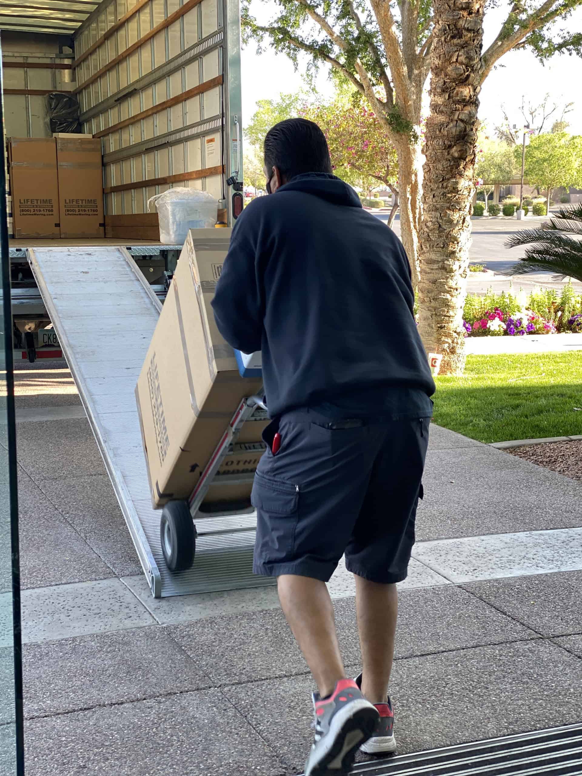 Lifetime Moving & Storage mover with a hand truck ready for a local move